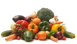 pile of colorful vegetables including bell peppers, broccoli and cucumbers